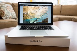MacBook Pro laptop sitting on its box