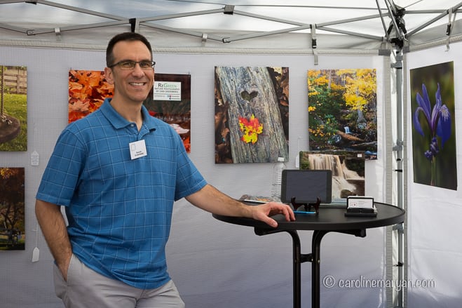 Dan Greenberg in his booth at Art on the Square in Williamsburg, VA.