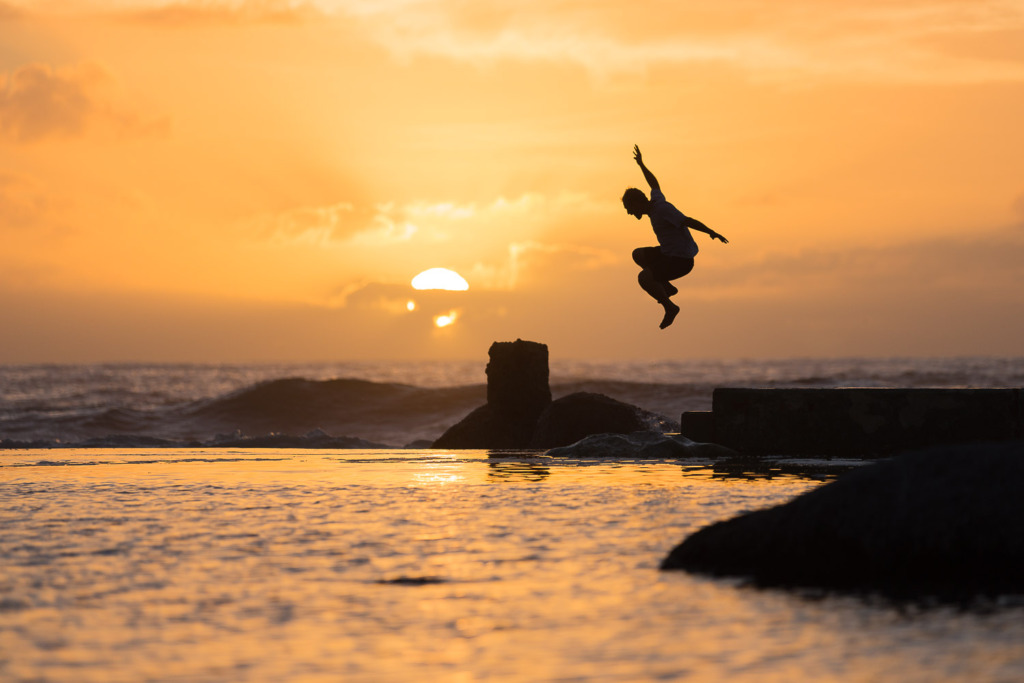 Silhouette of Jumping Man at Sunset