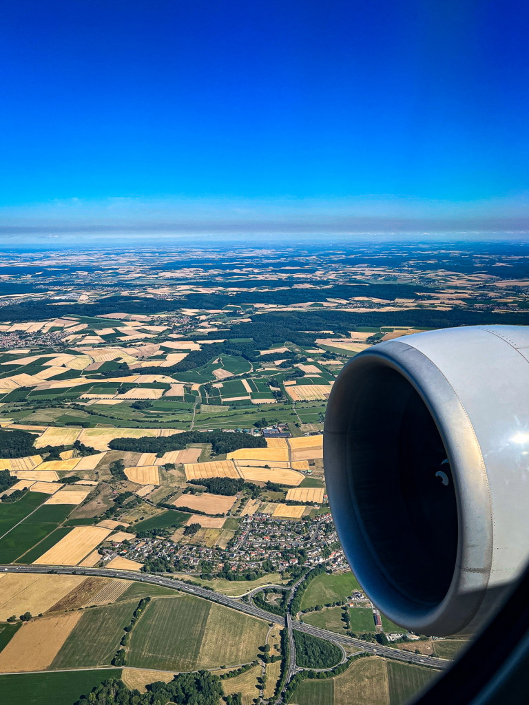 Aerial View from United Airlines above Hasselroth, Germany. Farmlands and the airplane engine are in the photo.