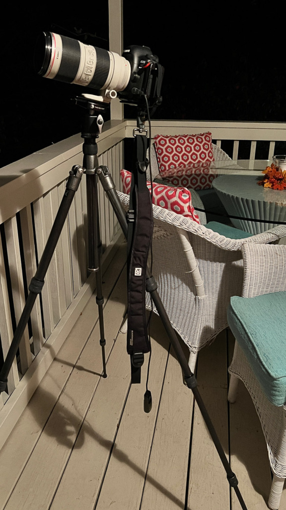 photo of Canon camera and lens on Gitzo tripod at night