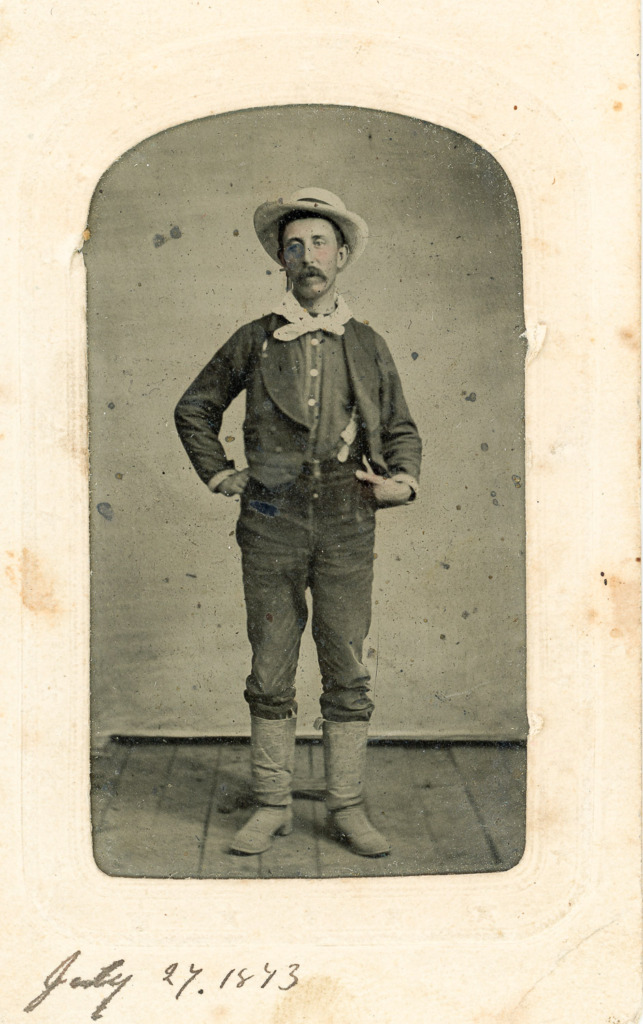 Photo of Jim Wardner dated July 27, 1873 with damage from the old album.
